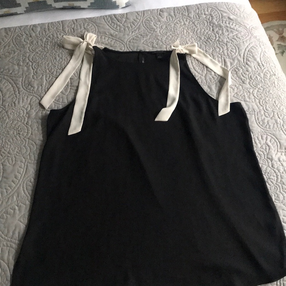 Classic black tank with a bow twist!